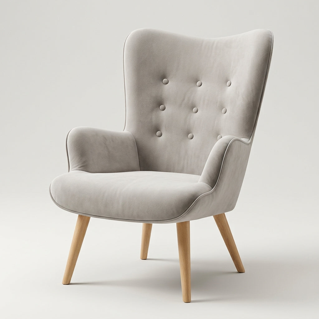 Sillón de lectura Tarina de terciopelo gris con respaldo alto capitoné y patas de madera, vista tres cuartos